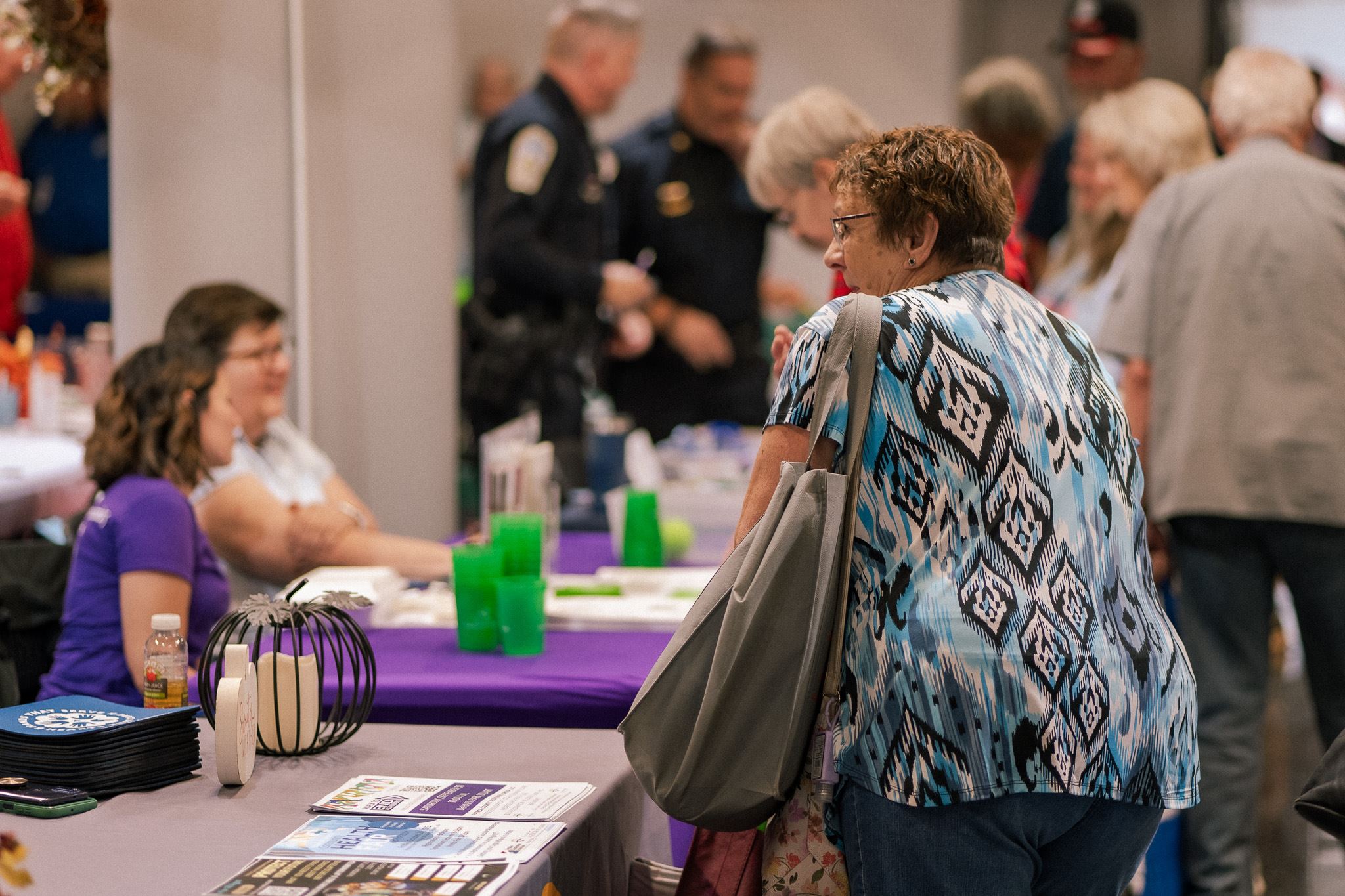A woman standing at an information booth